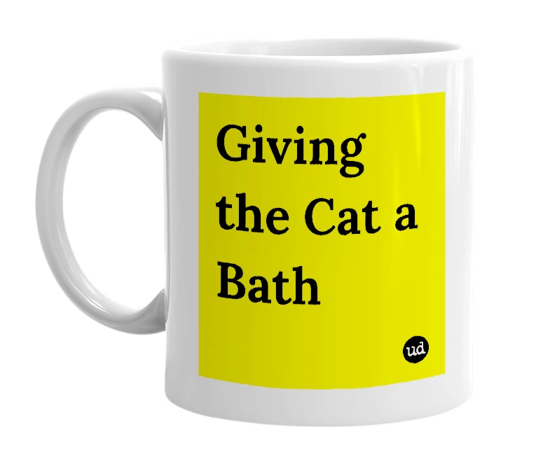 White mug with 'Giving the Cat a Bath' in bold black letters