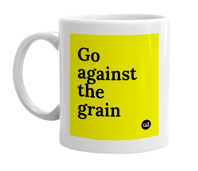 White mug with 'Go against the grain' in bold black letters