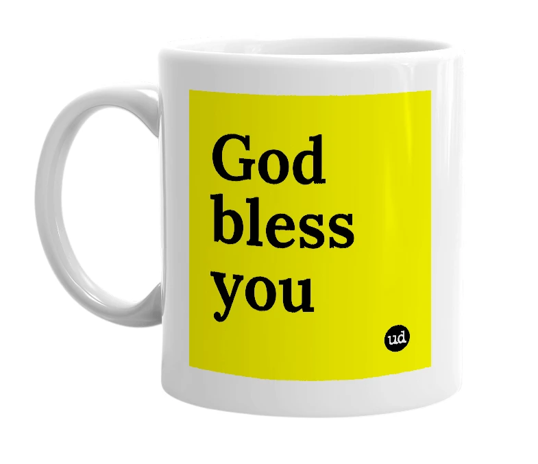 White mug with 'God bless you' in bold black letters