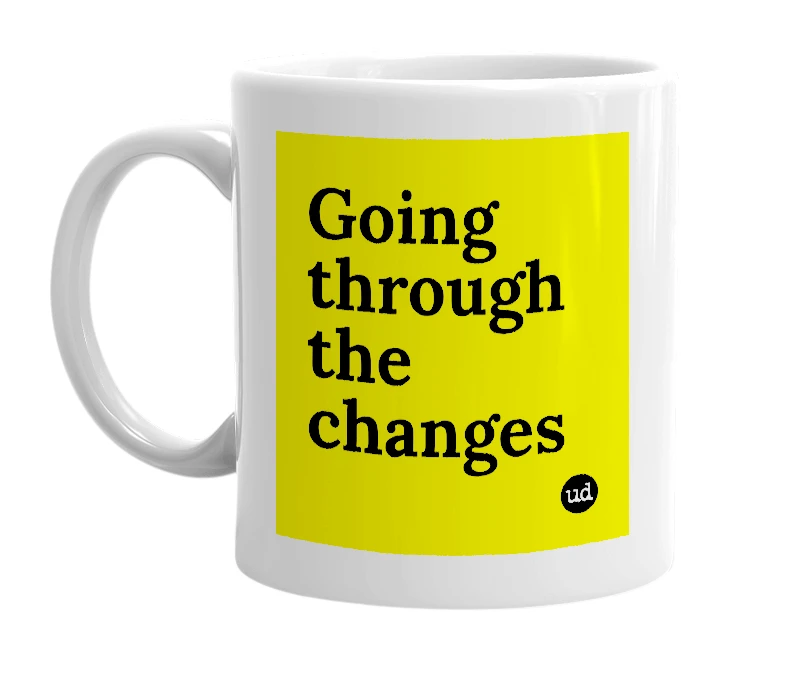 White mug with 'Going through the changes' in bold black letters