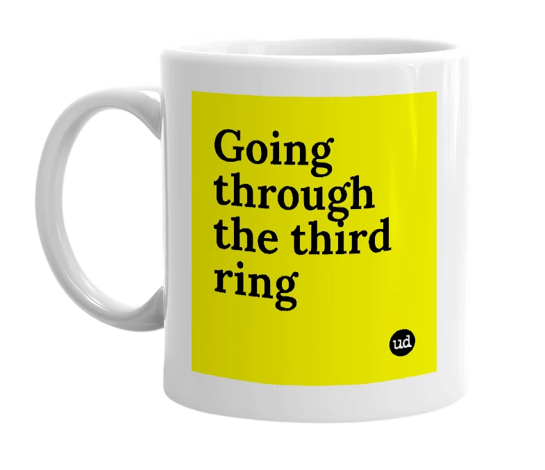 White mug with 'Going through the third ring' in bold black letters