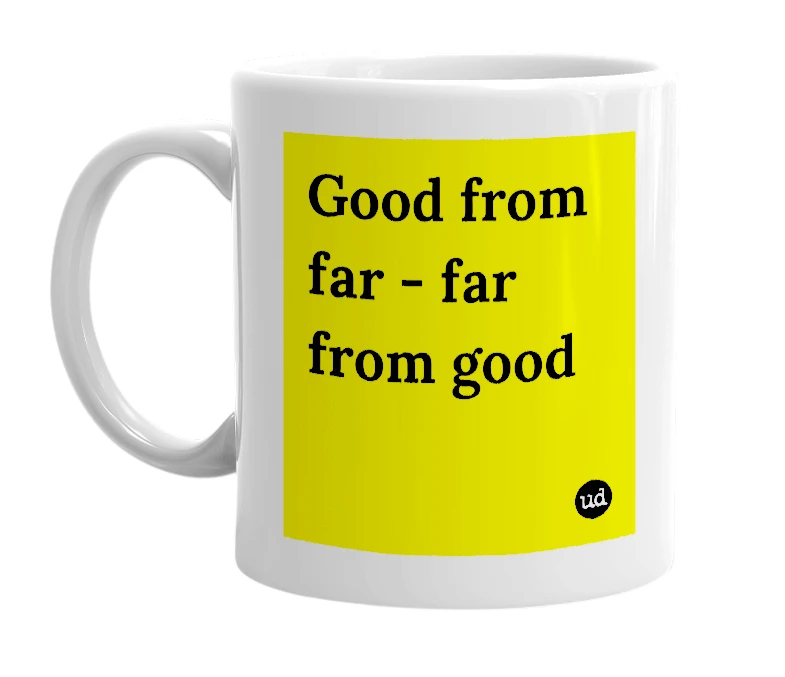 White mug with 'Good from far - far from good' in bold black letters