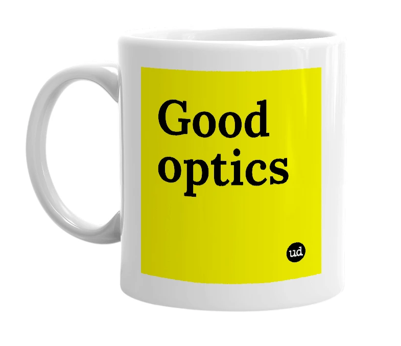 White mug with 'Good optics' in bold black letters