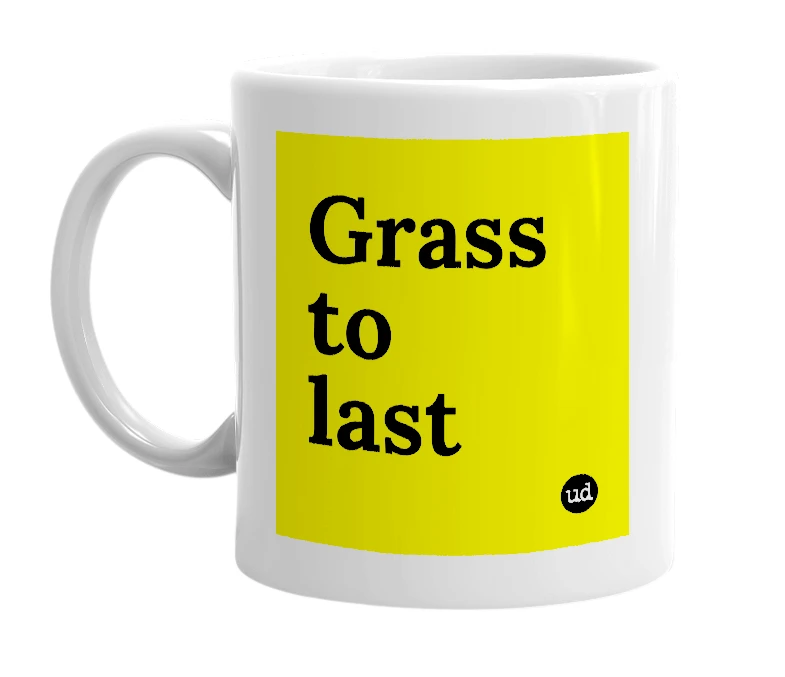 White mug with 'Grass to last' in bold black letters