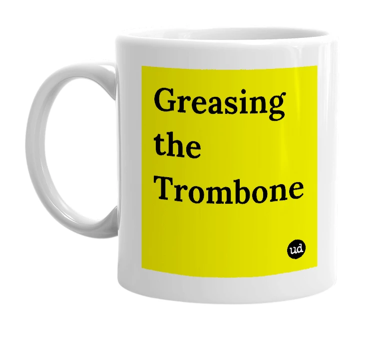 White mug with 'Greasing the Trombone' in bold black letters