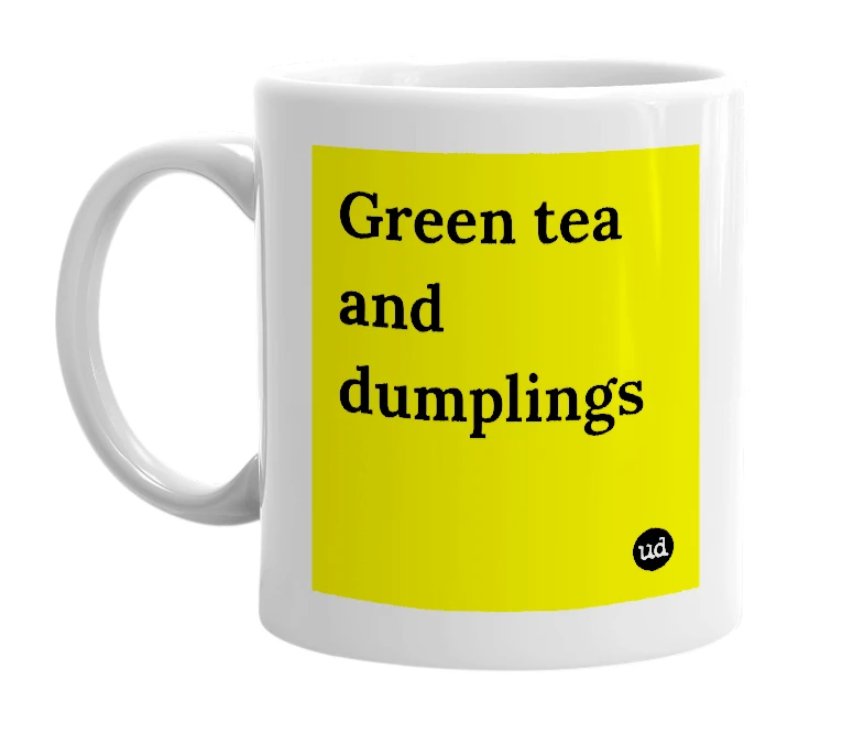 White mug with 'Green tea and dumplings' in bold black letters