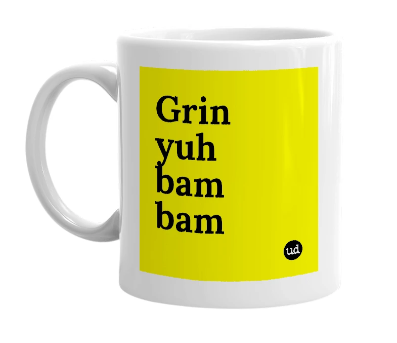 White mug with 'Grin yuh bam bam' in bold black letters