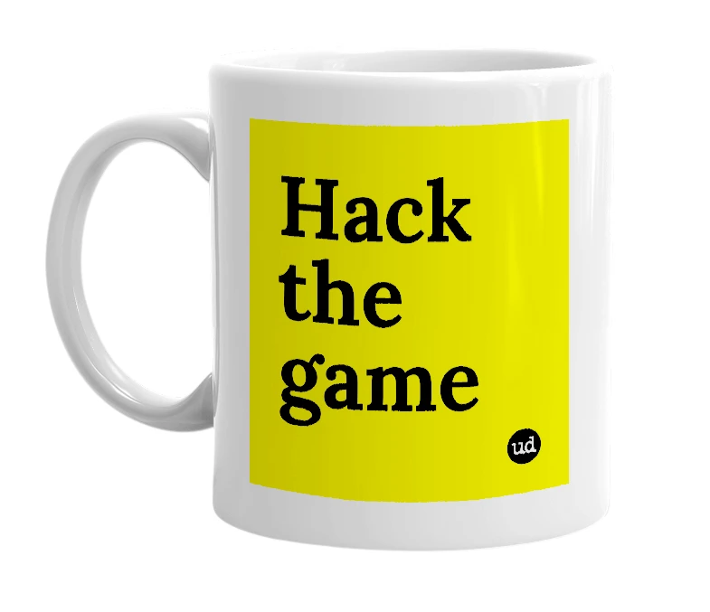 White mug with 'Hack the game' in bold black letters