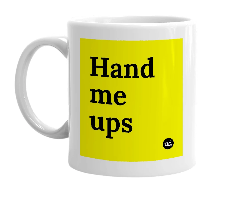 White mug with 'Hand me ups' in bold black letters