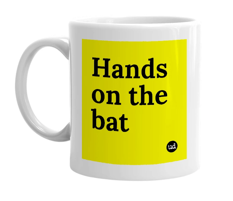 White mug with 'Hands on the bat' in bold black letters