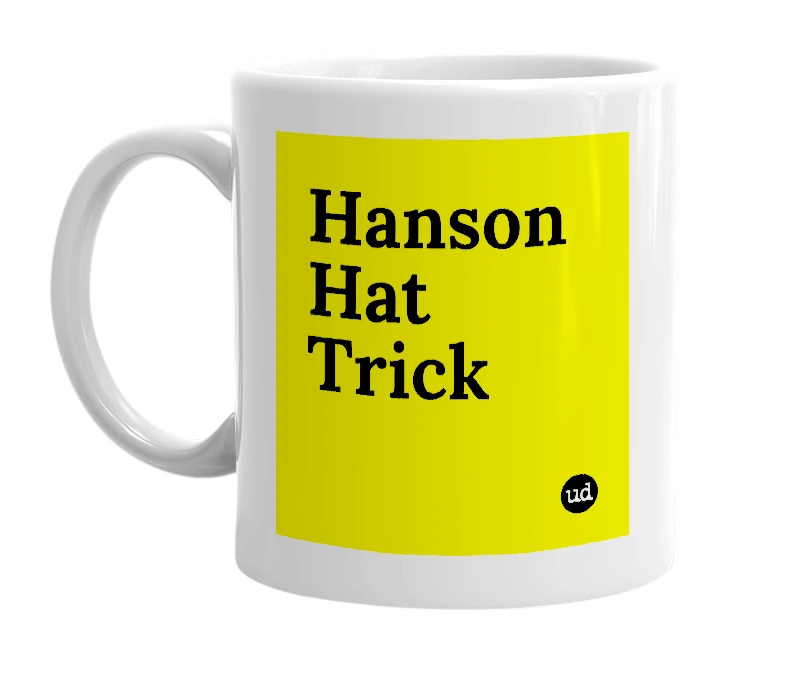 White mug with 'Hanson Hat Trick' in bold black letters