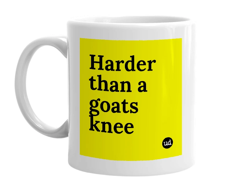 White mug with 'Harder than a goats knee' in bold black letters