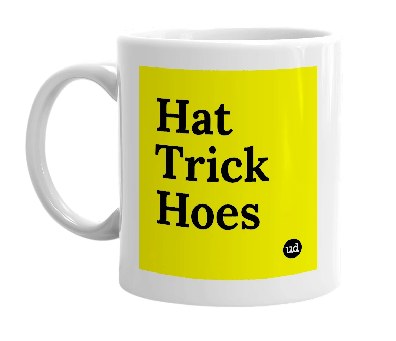 White mug with 'Hat Trick Hoes' in bold black letters