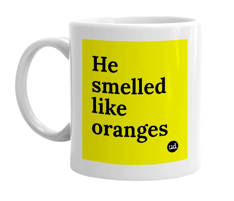 White mug with 'He smelled like oranges' in bold black letters