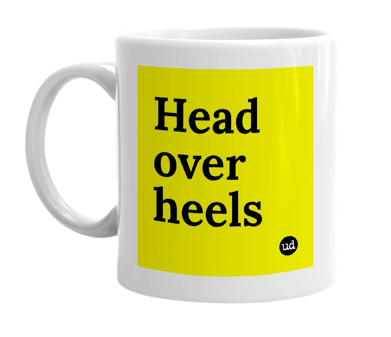 White mug with 'Head over heels' in bold black letters