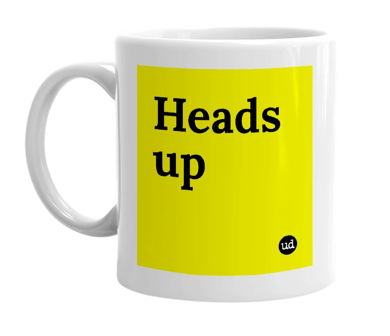 White mug with 'Heads up' in bold black letters