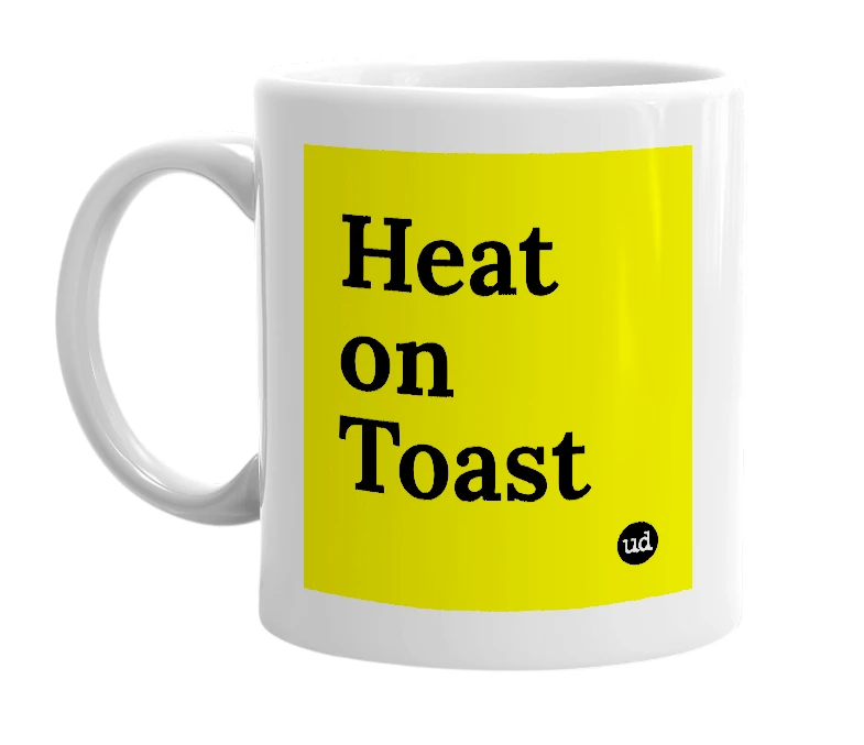 White mug with 'Heat on Toast' in bold black letters