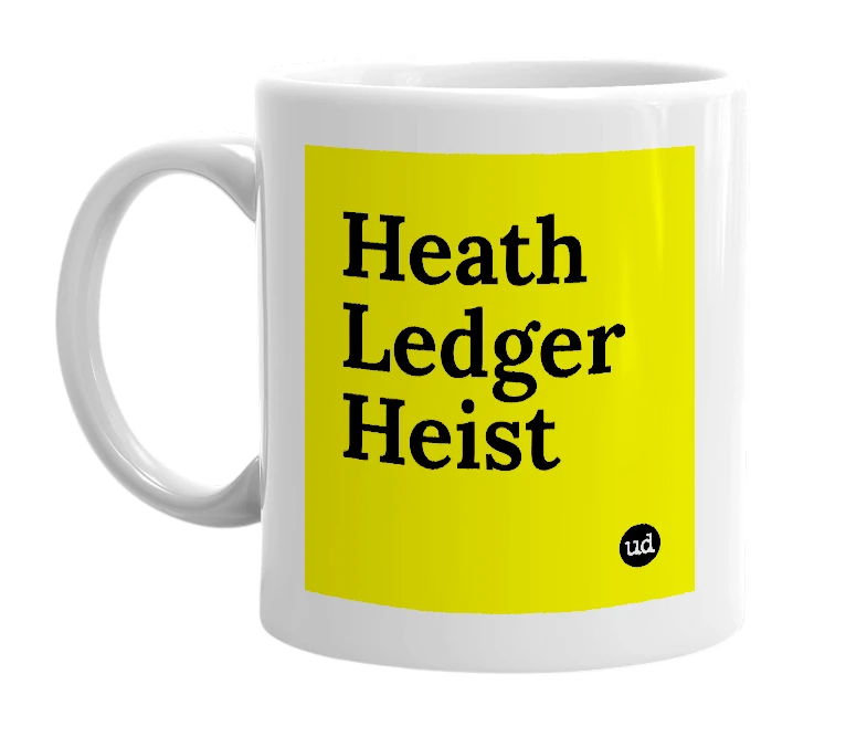 White mug with 'Heath Ledger Heist' in bold black letters