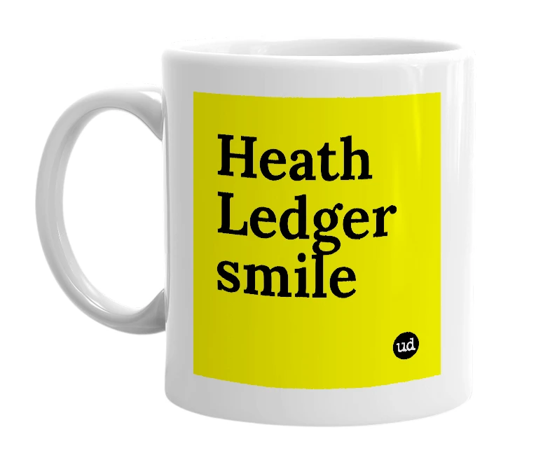 White mug with 'Heath Ledger smile' in bold black letters