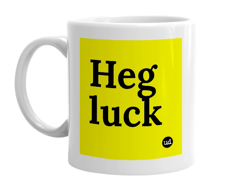 White mug with 'Heg luck' in bold black letters