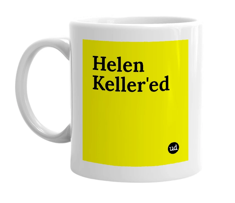 White mug with 'Helen Keller'ed' in bold black letters