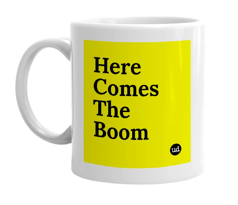 White mug with 'Here Comes The Boom' in bold black letters