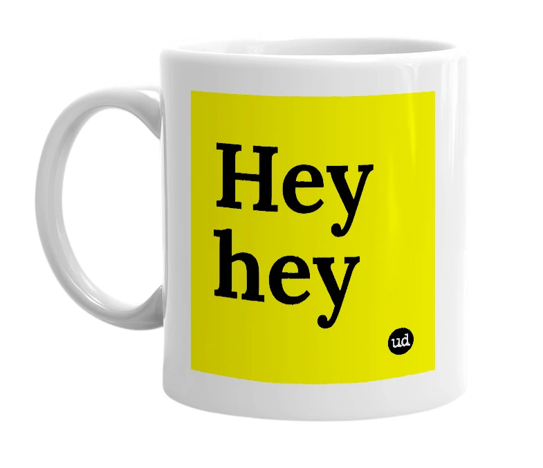 White mug with 'Hey hey' in bold black letters