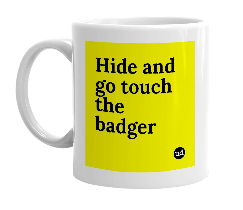 White mug with 'Hide and go touch the badger' in bold black letters