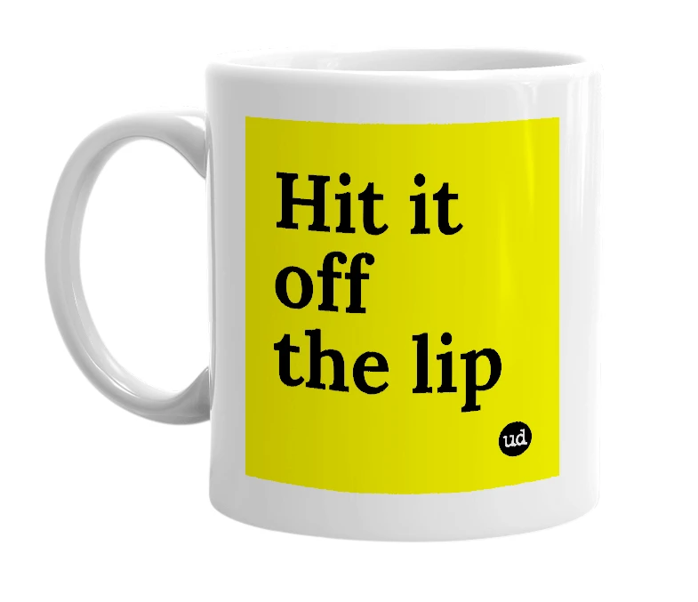 White mug with 'Hit it off the lip' in bold black letters