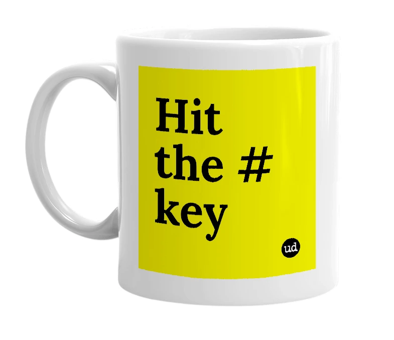 White mug with 'Hit the # key' in bold black letters