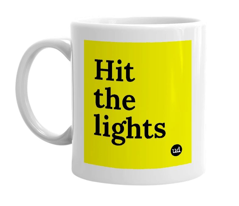 White mug with 'Hit the lights' in bold black letters