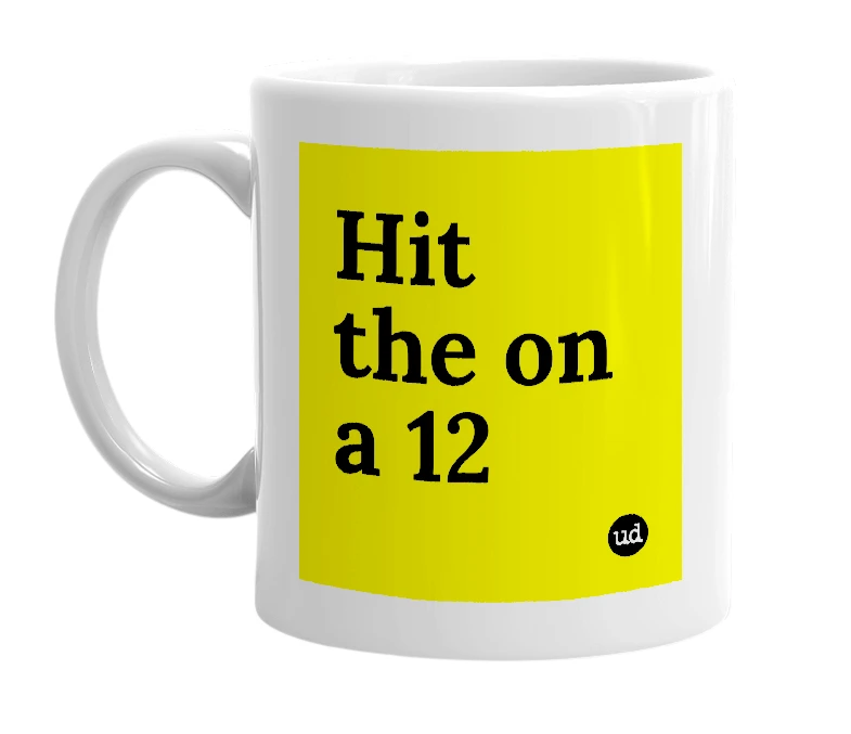 White mug with 'Hit the on a 12' in bold black letters