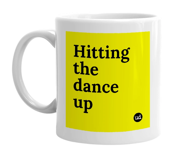 White mug with 'Hitting the dance up' in bold black letters