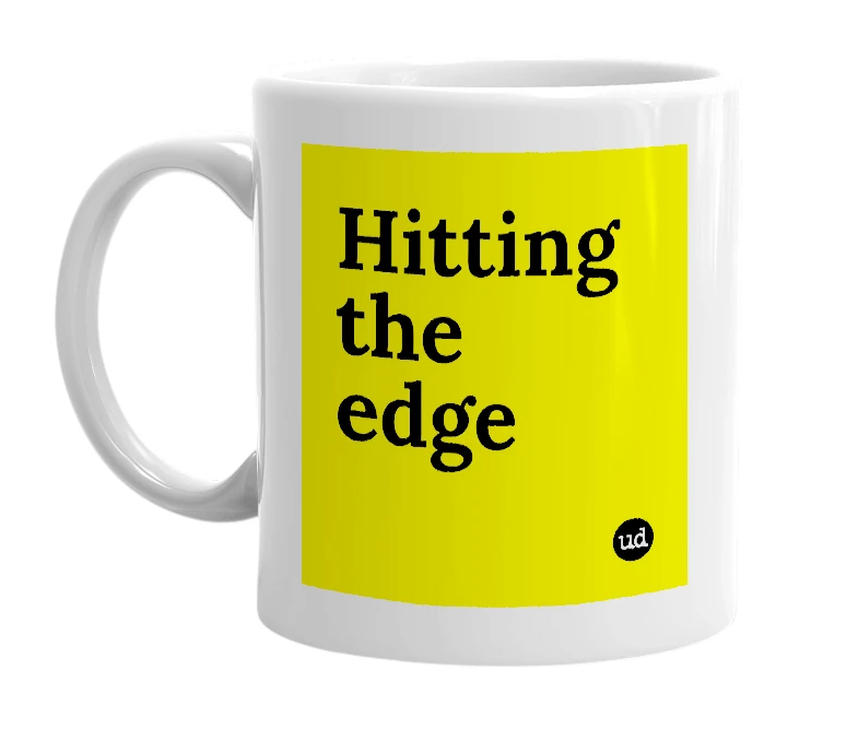 White mug with 'Hitting the edge' in bold black letters