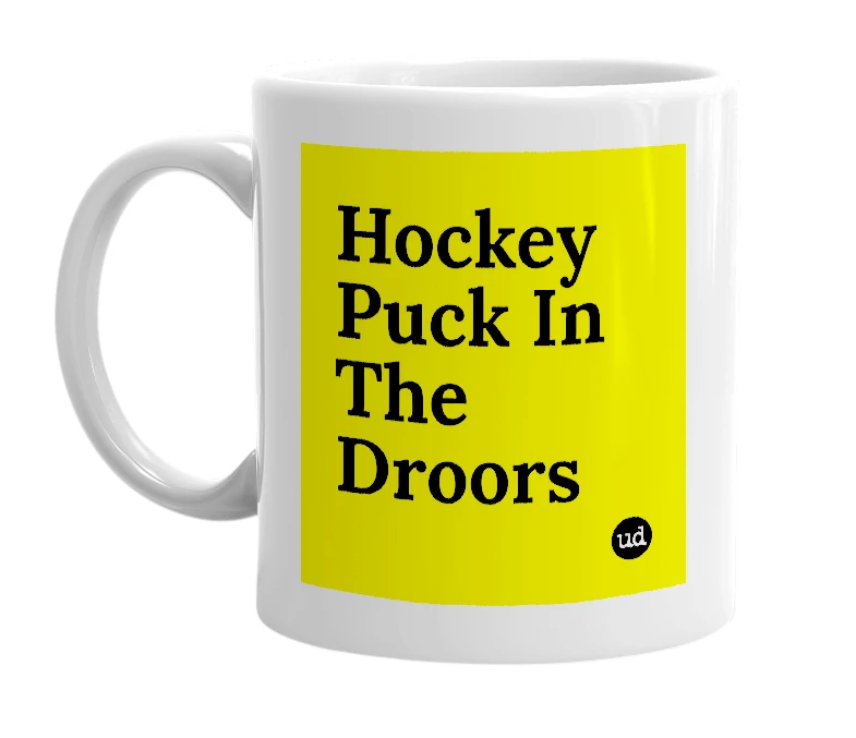 White mug with 'Hockey Puck In The Droors' in bold black letters