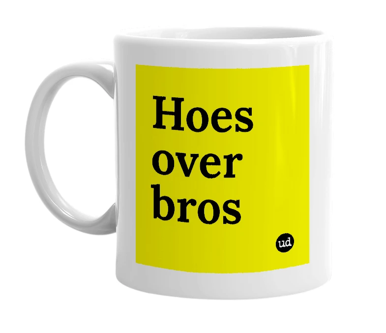 White mug with 'Hoes over bros' in bold black letters