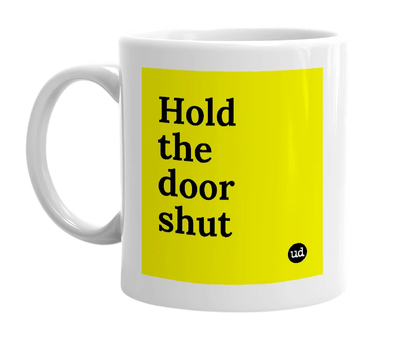 White mug with 'Hold the door shut' in bold black letters