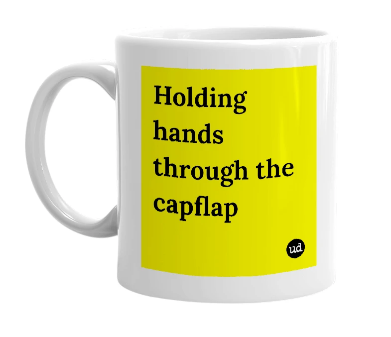 White mug with 'Holding hands through the capflap' in bold black letters