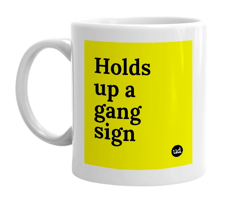 White mug with 'Holds up a gang sign' in bold black letters