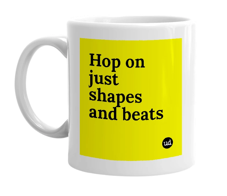 White mug with 'Hop on just shapes and beats' in bold black letters