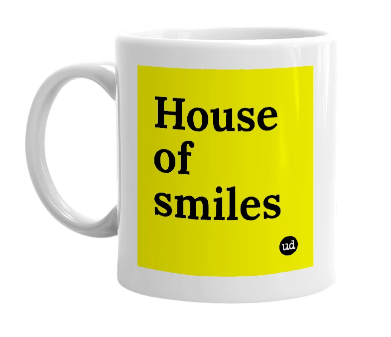 White mug with 'House of smiles' in bold black letters