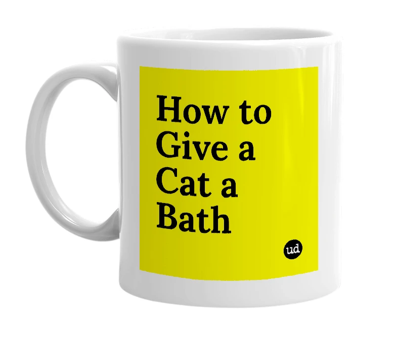 White mug with 'How to Give a Cat a Bath' in bold black letters
