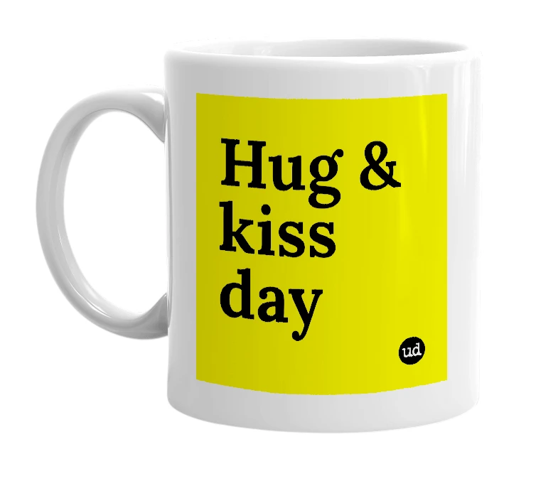White mug with 'Hug & kiss day' in bold black letters