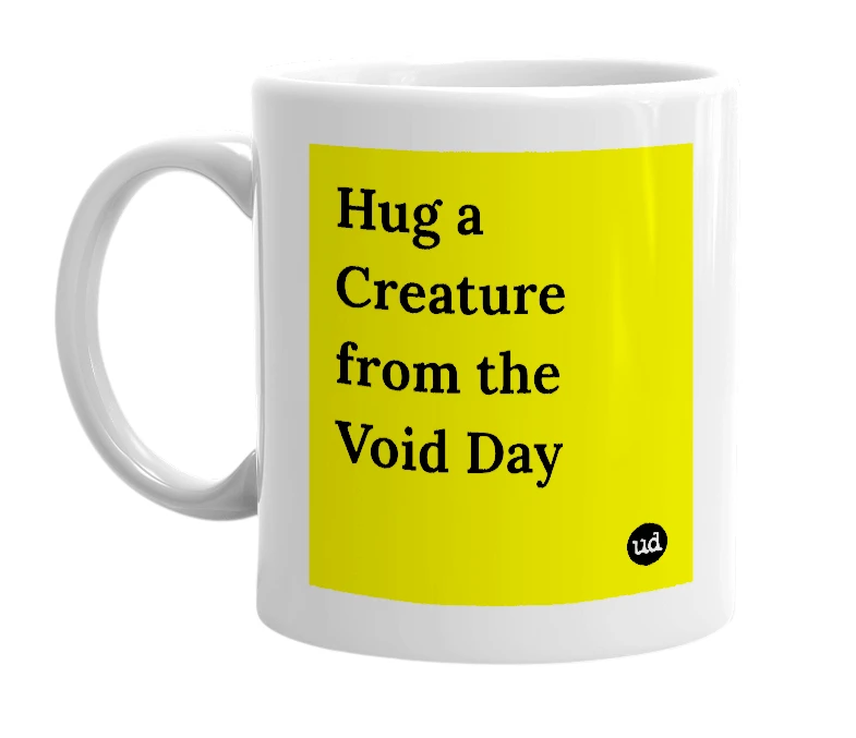 White mug with 'Hug a Creature from the Void Day' in bold black letters