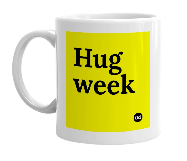White mug with 'Hug week' in bold black letters