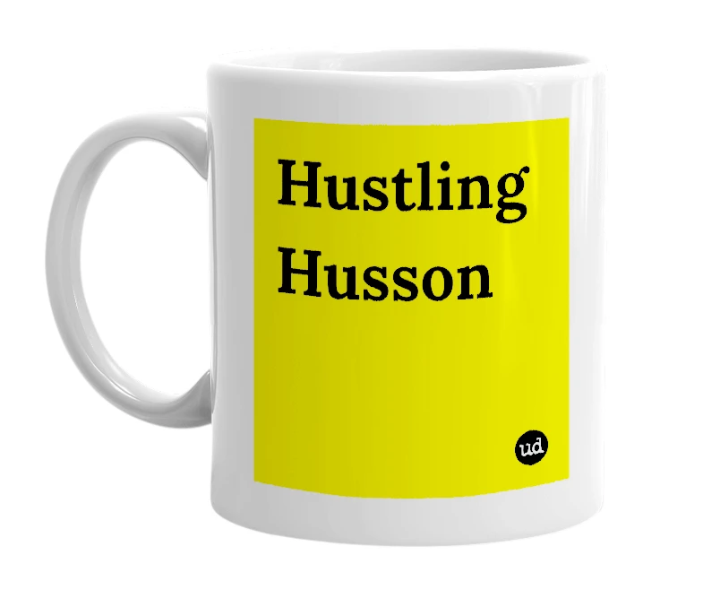 White mug with 'Hustling Husson' in bold black letters
