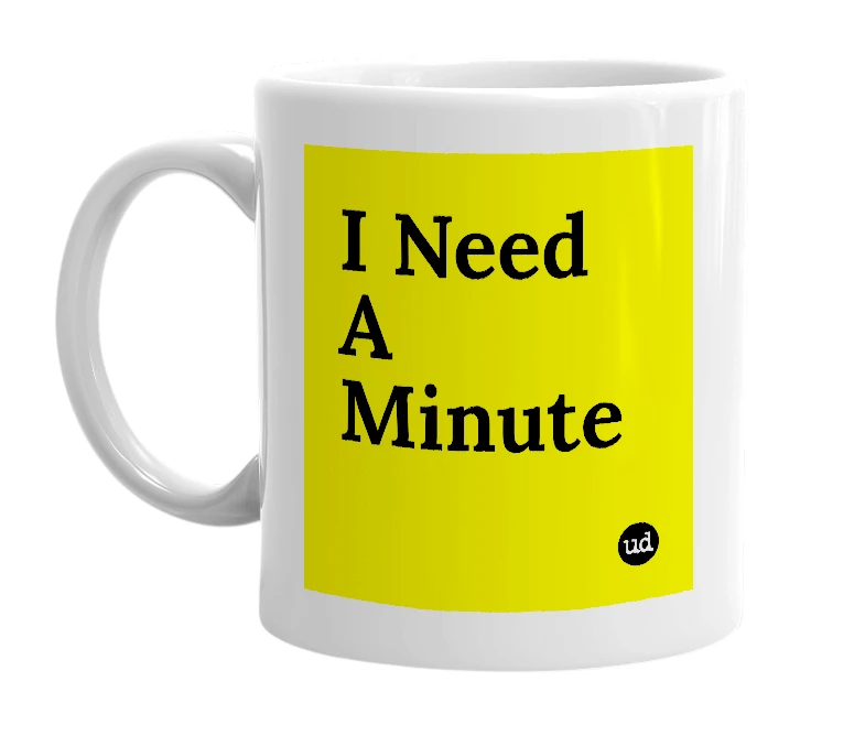 White mug with 'I Need A Minute' in bold black letters