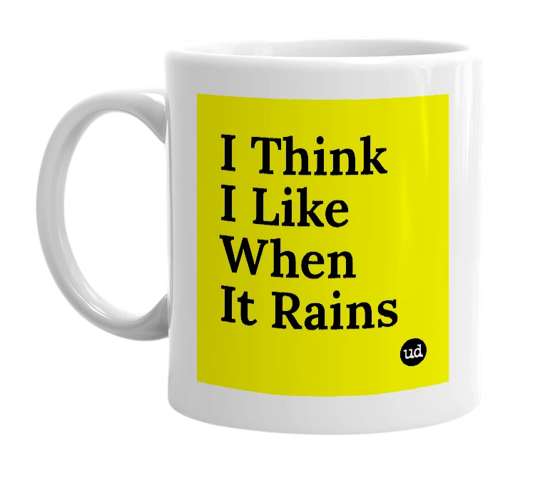 White mug with 'I Think I Like When It Rains' in bold black letters