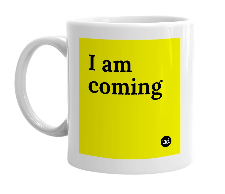 White mug with 'I am coming' in bold black letters