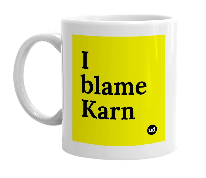 White mug with 'I blame Karn' in bold black letters
